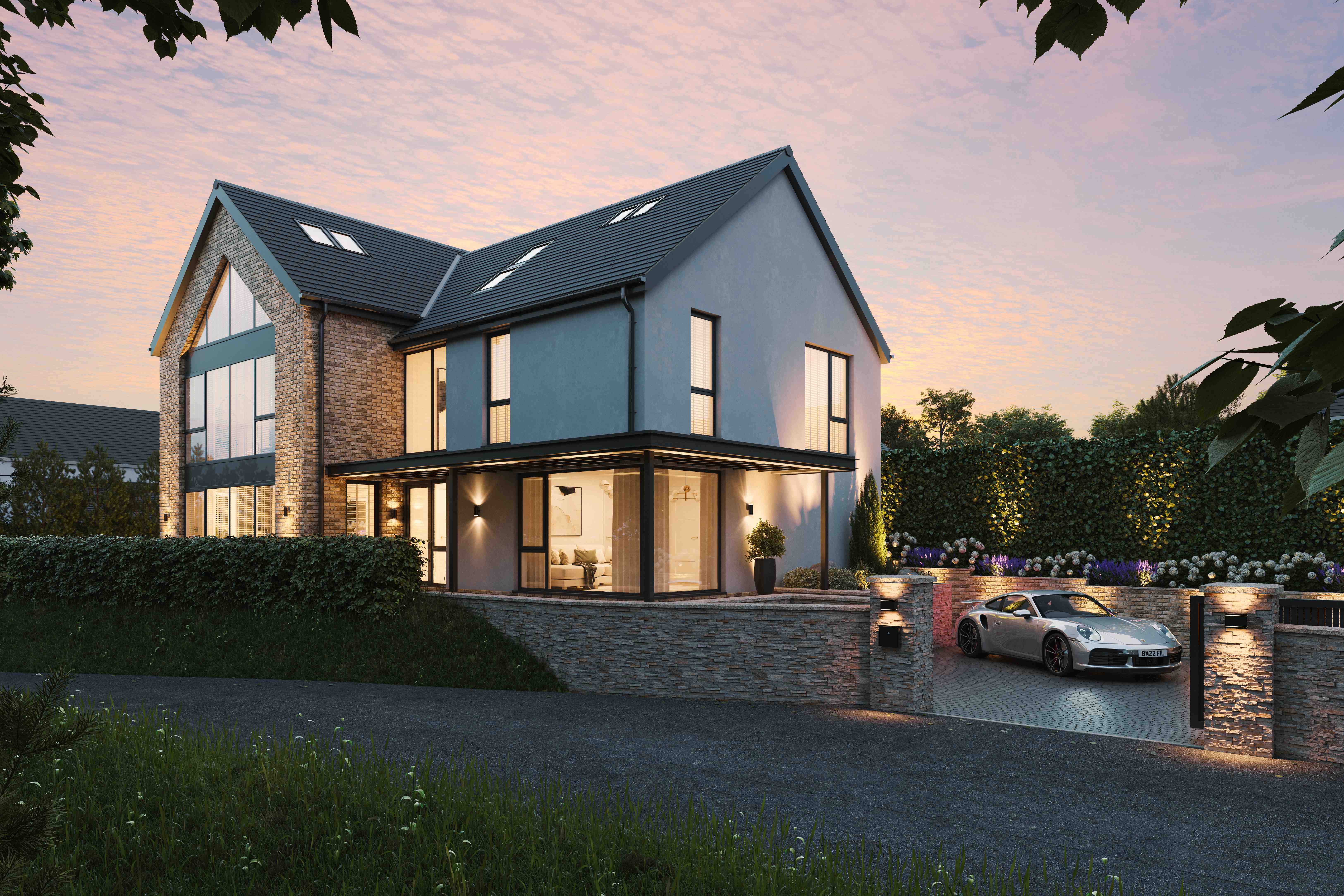 Completed Homes by JR luxury new-build home at dusk in South Wales